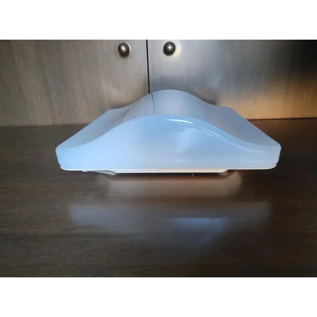 Rare pair of ceiling lights, wall lamps, "wave" model - 5363, Iguzzini production of the 70s, made of white acrylic glass...