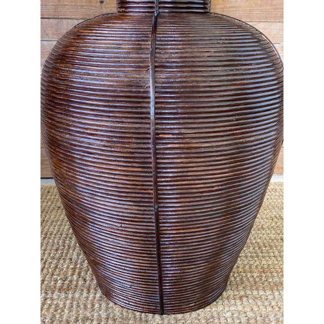 Statement piece with this large vintage pencil Reed rattan vase by Palecek in great condition. This is a large piece and...