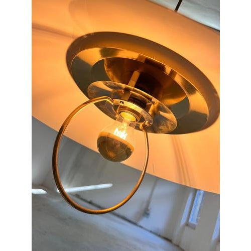This pendant lamp from Denmark is a statement piece that combines the cool elegance of Scandinavian design with luxurious...