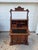 A commanding late 19th to early 20th century secretary desk that embodies the richness of Victorian craftsmanship. The...