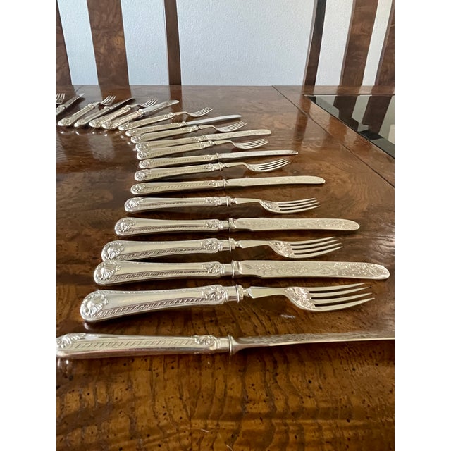 Ornate antique boxed set of Victorian silver plated flatware. This set features place setting for 18 people. This set was...