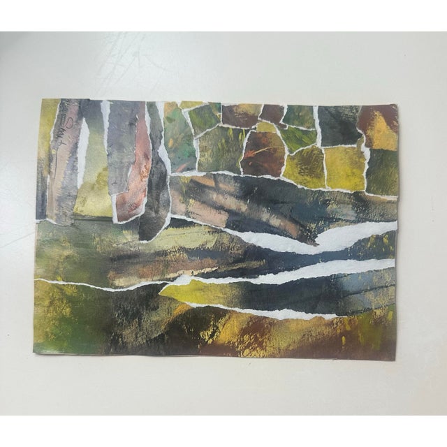 An earthy, modern abstract composed of layered, torn-paper forms in rich woodland hues. Deep olive, moss, umber, and...