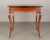 An early 19th century Louis XV style Country French side table with a cherry wood base and a walnut top. Two dovetailed...
