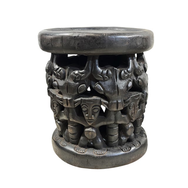 Unique large Bamileke Spider Stool from Cameroon—a striking carved wood piece handcrafted from a single wooden form with...