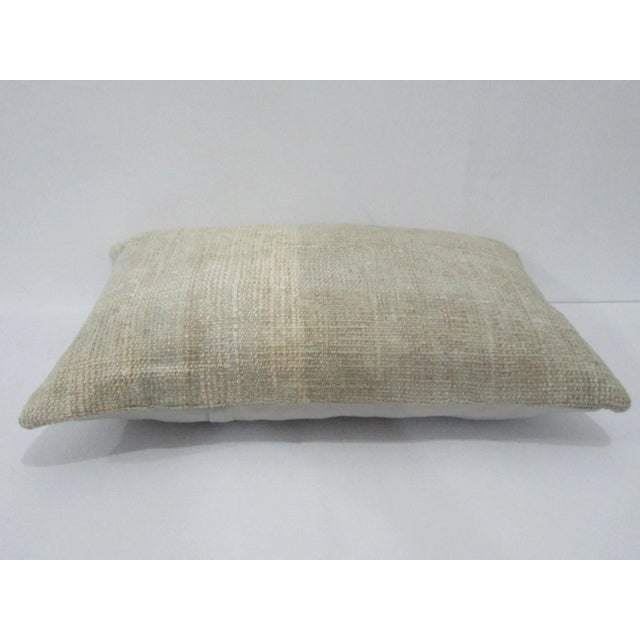 Decorative pillow cover made from a vintage Turkish handknotted rug. Backed with good quality cotton fabric. Pillow...