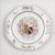 Famille rose Chinese export porcelain armorial plate of octagonal form decorated with sparsely placed sprays of flowers...