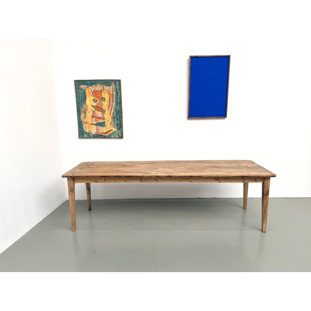 Maison lecan presents this solid pine farmhouse table, france, 1950s. The tabletop is original: wide, thick, with an open...