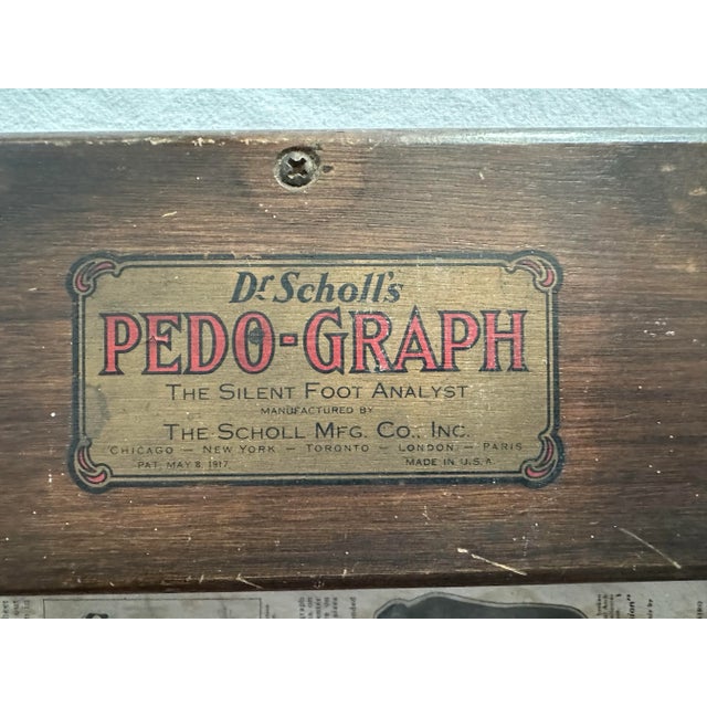 Wooden display box from Dr. Scholl's. It has the original decal on the front identifying it as the "Pedo-Graph", the...