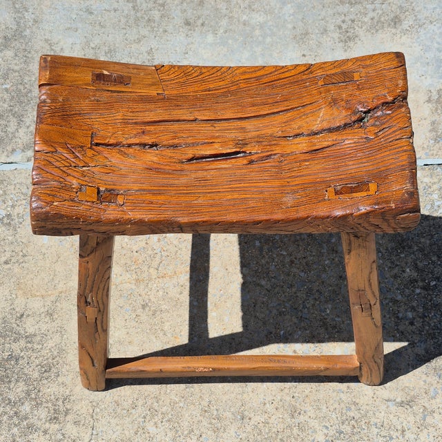 This is a rustic Asian elm wood stool with tons of character and texture. The stool is made of solid hand-hewn elm wood...