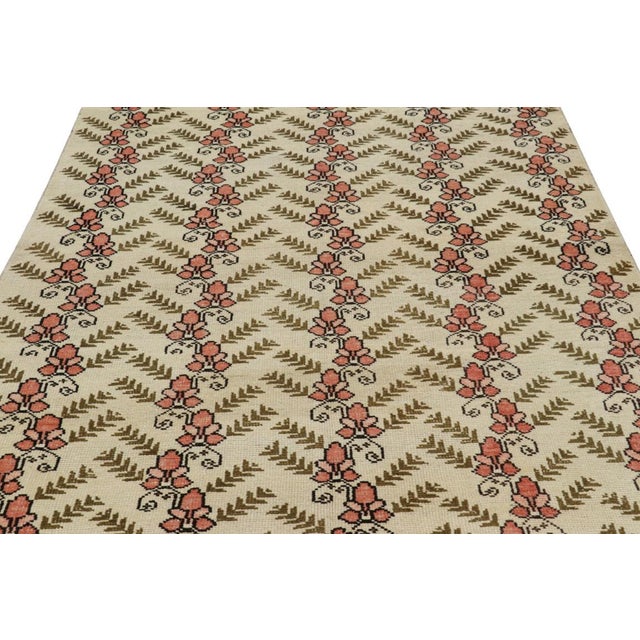 Made with hand-knotted wool, this 5x9 vintage Turkish Sparta rug featuring a floral design is an exciting new addition to...