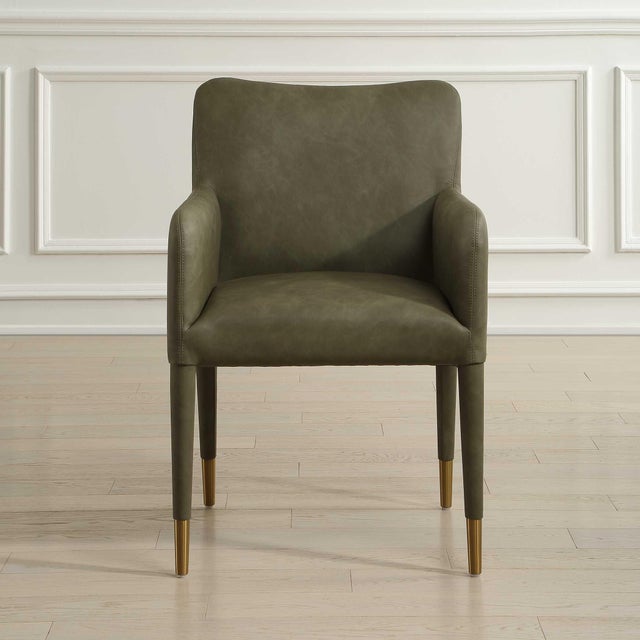 Perfect For Modern Dining, This Armchair Features Sleek Lines Covered In A Pine Green Distressed Faux Leather Accented...