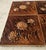 This lovely set of six embossed “Burnt Umber” chrysanthemum tiles is nearly in pristine condition. While there’s no stamp...