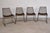 Set of four Sonoma chairs featuring finely woven wire mesh seats and backs paired with minimalist sled-style iron bases....