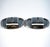 Two elegant, simple silver serving dishes with smooth sides – flat, oblong bowls with a recess for a glass top, and a...