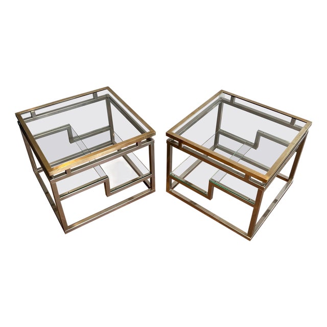 Pair of designer side tables in chrome, brass and glass. French work. Circa 1970. For Sale