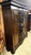 A study bookcase crafted in the early 20th century, representing the pinnacle of European cabinetmaking from the late...