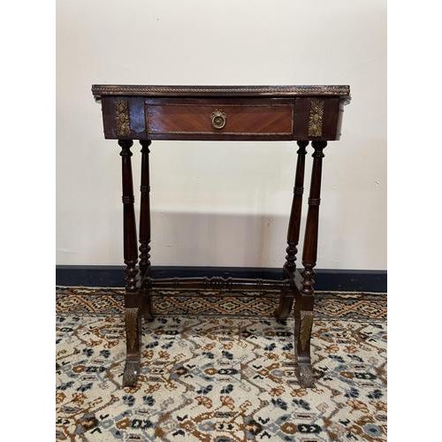 A beautiful Louis XV style side table featuring mahogany and kingwood inlay with elegant brass detailing. Designed with a...
