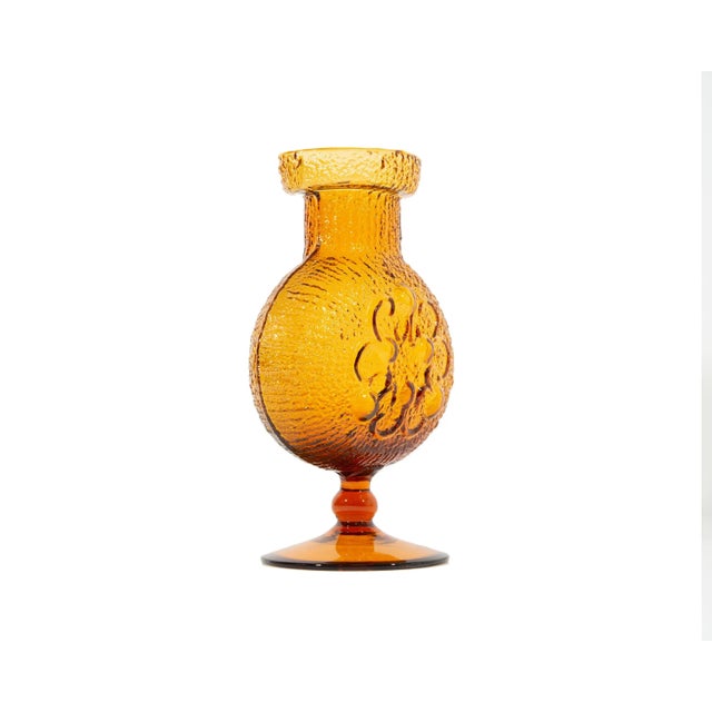 An orange glass Stelvia "Antigua" vase designed by American glass artist and designer Wayne Husted. This handblown footed...