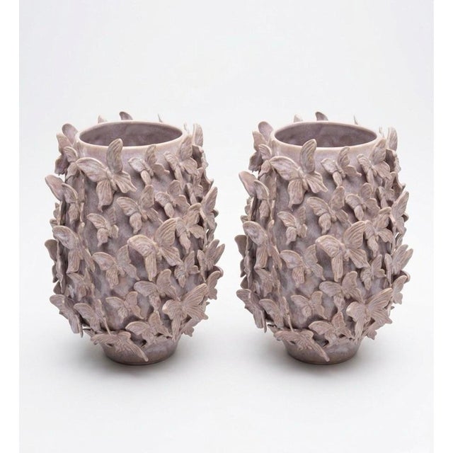 This striking pair of vintage Italian ceramic vases features a lush, high-relief design of delicate butterflies blanketing...