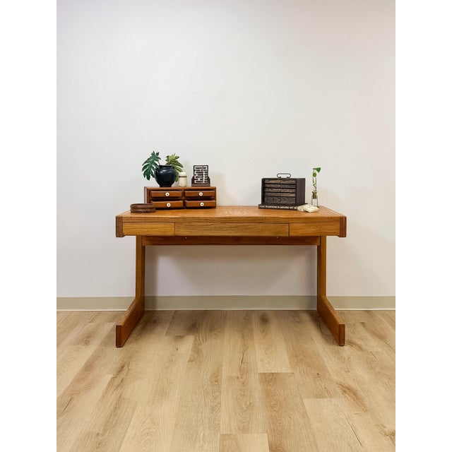 This handmade vintage desk captures the sculptural, organic modern sensibility associated with Lou Hodges-style design,...