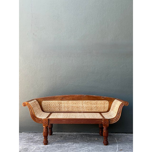 This exceptional vintage Anglo-Indian settee is a masterful blend of British Colonial structure and tropical artisanal...