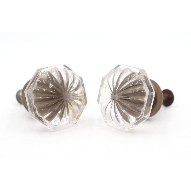 Vintage cabinet or drawer knobs made of clear glass with an octagon shape and brass shanks. Mounting screws are included....