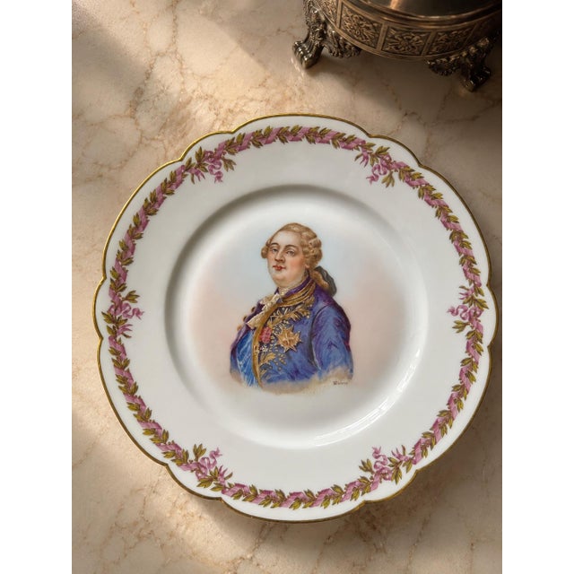 Antique French porcelain cabinet plate featuring a finely hand-painted portrait of King Louis XVI in royal dress, signed...