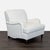 This Pottery Barn lounge chair offers a simple and elegant design with soft white upholstery and classic wooden legs. The...