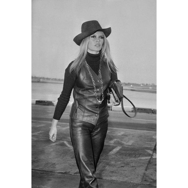 Brigitte Bardot French actress, singer and fashion model Brigitte Bardot wearing leather waistcoat, high-collar shirt,...