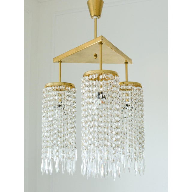 A beautiful vintage chandelier by Jablonecké sklárny, combining sculptural Czechoslovak glassmaking with an elegant solid...
