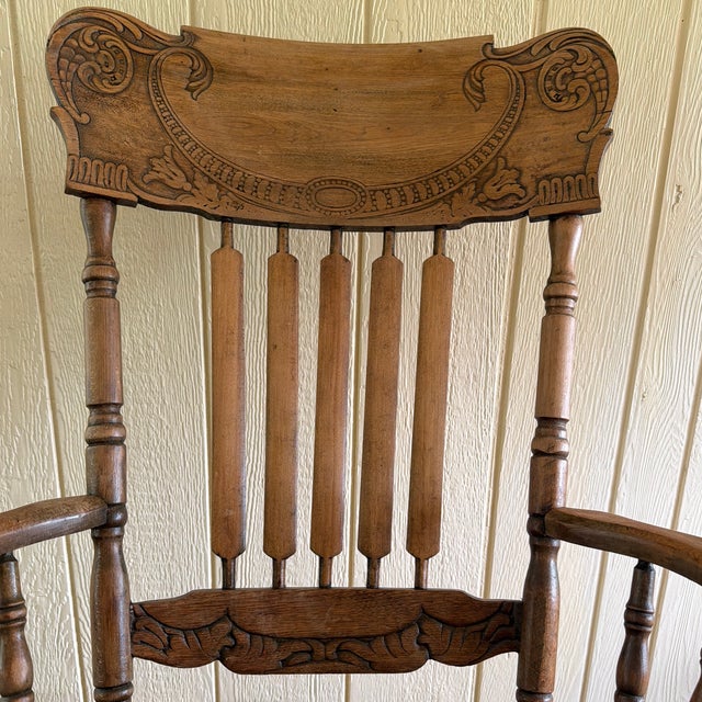 Bring a touch of historic American charm into your home with this stunning turn-of-the-century rocking chair. Crafted from...