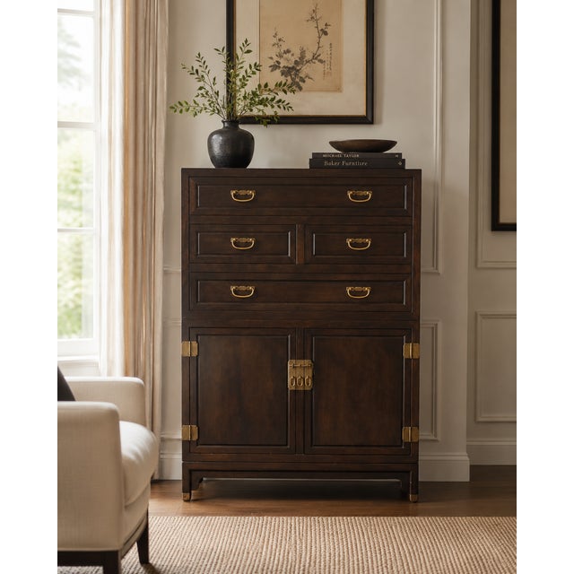 A refined and architecturally composed gentleman’s chest designed by Michael Taylor for Baker Furniture, showcasing the...
