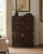 A refined and architecturally composed gentleman’s chest designed by Michael Taylor for Baker Furniture, showcasing the...