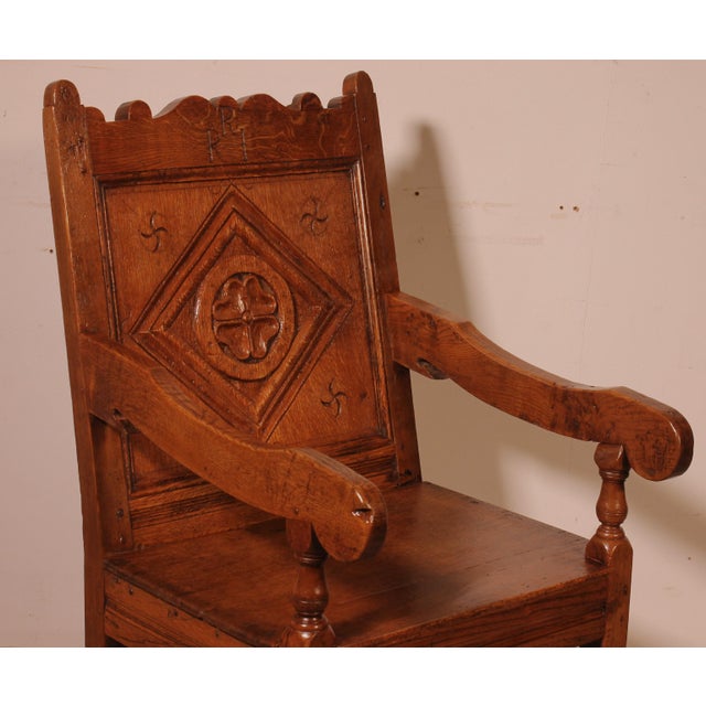 Superb 17th-century English joined-arm chair, also known as a Wainscot armchair. Superb carved back featuring initials and...