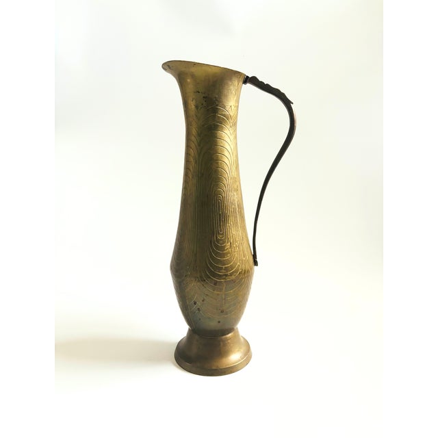 A large vintage brass pitcher. Elegant shape with a beautiful geometric etched design to the surface. A nice large size...