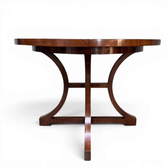 Beautiful center table by luxury furniture maker Dessin Fournir. Handmade in Los Angeles of Walnut, the table has a warm...