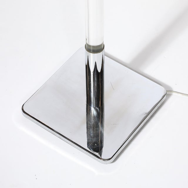 This Mid-Century Modernist floor lamp, crafted by Hansen, demonstrates the era's seamless blend of sleek materials and...