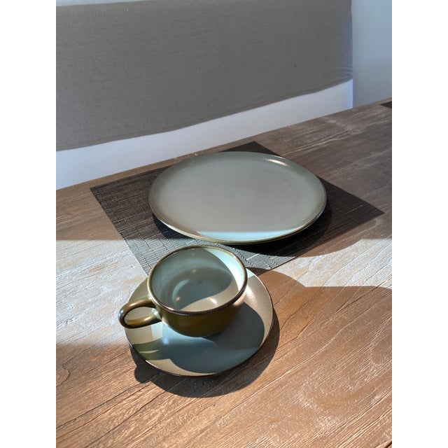 (4) settings - plate, cup an saucer.