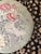 Large, pretty piece. 27" round pouf footstool? On wheels. I would not say this is embroidered, seems like maybe a rug with...