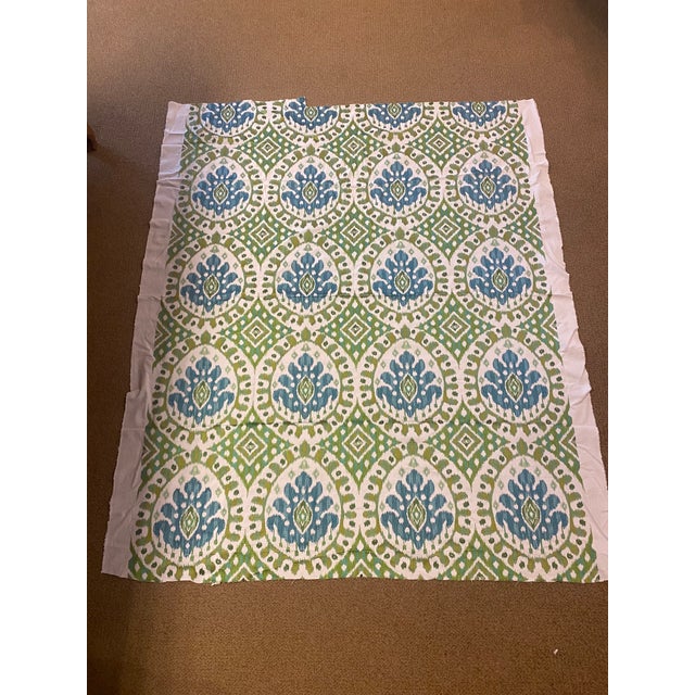 Manuel Canovas' "Bella Aqua" fabric features boldly embroidered medallions in Aqua and Green on a cream colored ground....