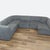 The Astaire modular sectional with gray upholstery has deep seating with attached back cushions. Brand: Room and Board....