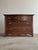 A handsome turn-of-the-century oak chest of drawers showcasing the rich figuring and craftsmanship that made American...
