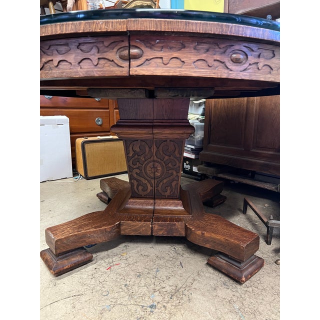 American Golden Oak / Renaissance Revival style split-pedestal dining table, dating roughly from the late 1890s to the...