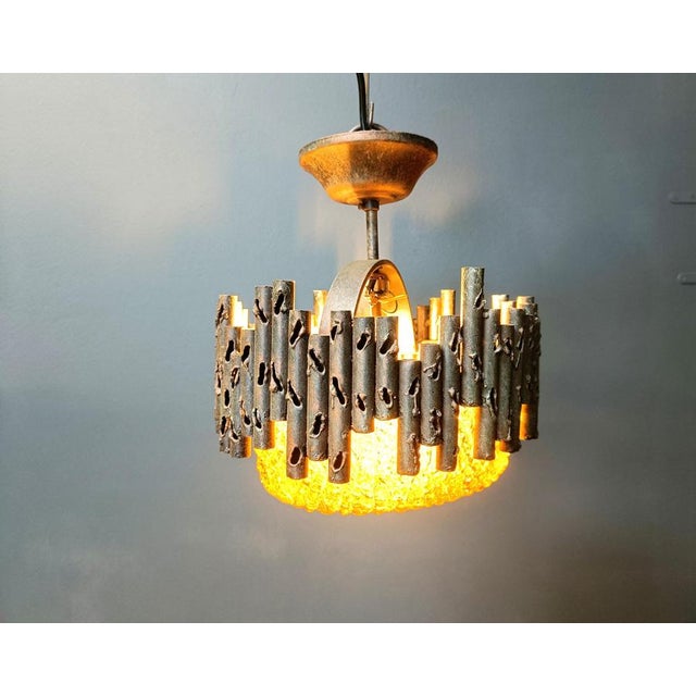 Striking brutalist pendant lights designed by renowned designer and artist Marcello Fantoni and produced in Italy....