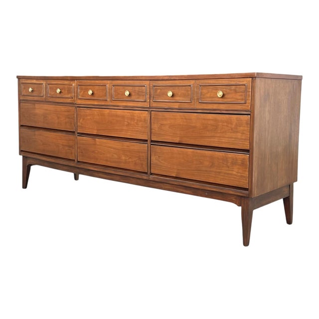 This 1960s Mid-Century walnut chest of drawers has been fully restored and presents beautifully in a warm light walnut...