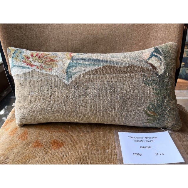 This exceptional 17th century Brussels tapestry pillow is crafted from a rare Flemish tapestry fragment, showcasing the...
