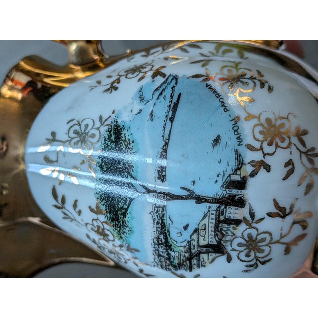 This vintage Bavaria porcelain demitasse tea set features a scenic "Napoli Panorama" transfer motif accented by lavish 24K...