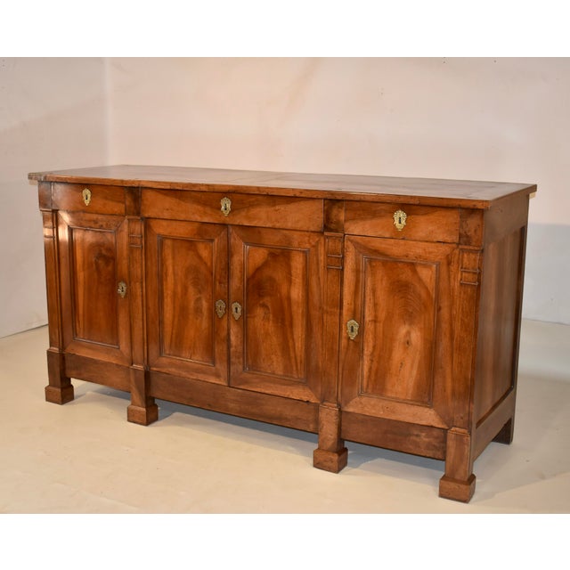 18th century walnut Directoire enfilade from France. The top is made from the most gorgeous matched grain planks, and...