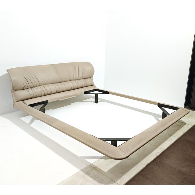 The "Vela" double bed, an icon of Italian design created by Giovanni Offredi for Saporiti Italia around 1980. The bed...