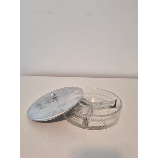 Striking vintage mid-century vanity or trinket jar combining a substantial clear pressed-glass base with an intricately...